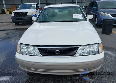 1999 Toyota Avalon Xls z USA, uszkodzony, nr VIN 4T1BF18B8XU335587
